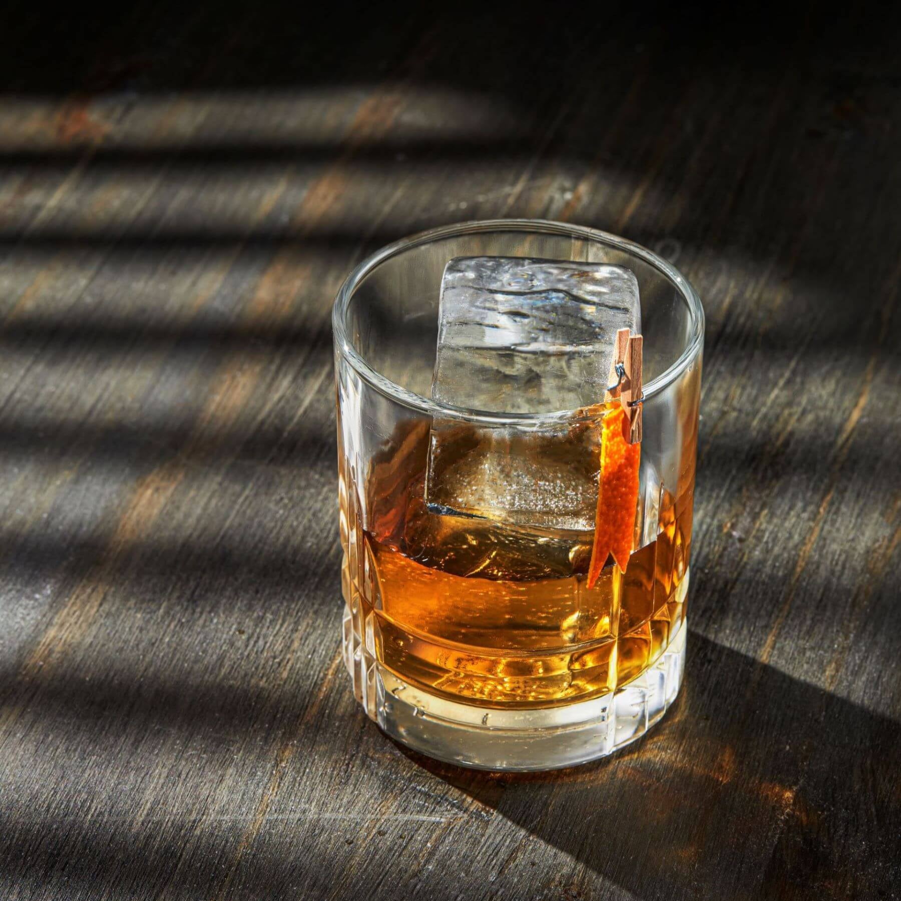 Chilled Ice Cube in a Whiskey Glass